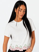 T-shirt con ricami ciligie bordo ondulato