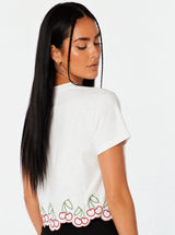 T-shirt con ricami ciligie bordo ondulato