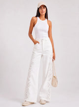 Pantalone denim a palazzo con ricami sui lati