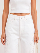Pantalone denim a palazzo con ricami sui lati